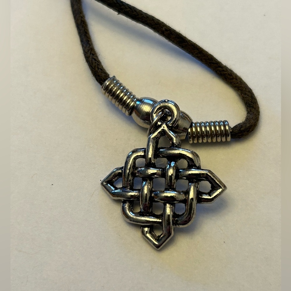 Celtic Necklace. Silver-tone endless knot. Black rope chain.